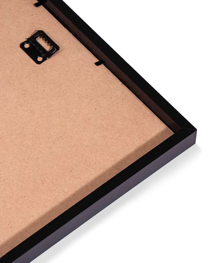 Close-up of a black picture frame corner with a white background