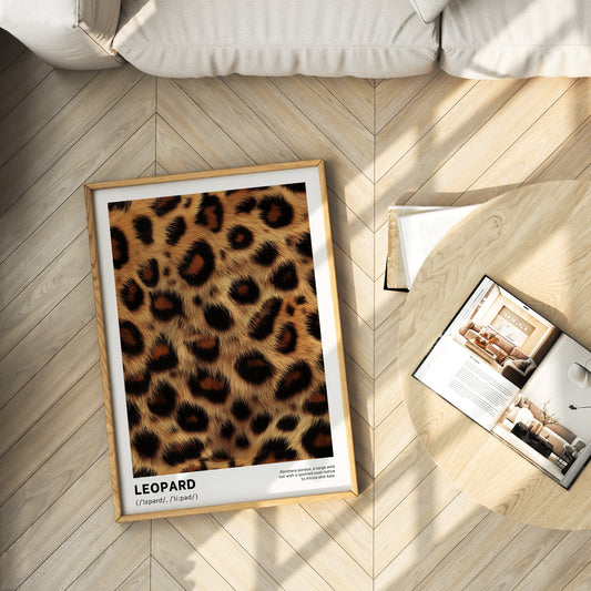 Framed poster with leopard print design on a wooden floor