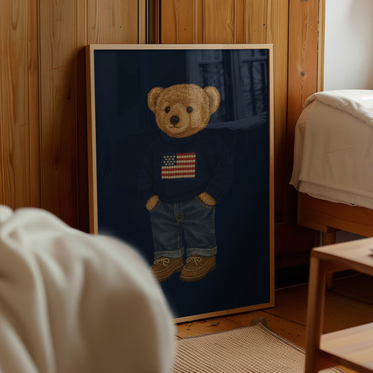Framed picture of a teddy bear wearing an American flag shirt in a room with wooden walls and a bed.