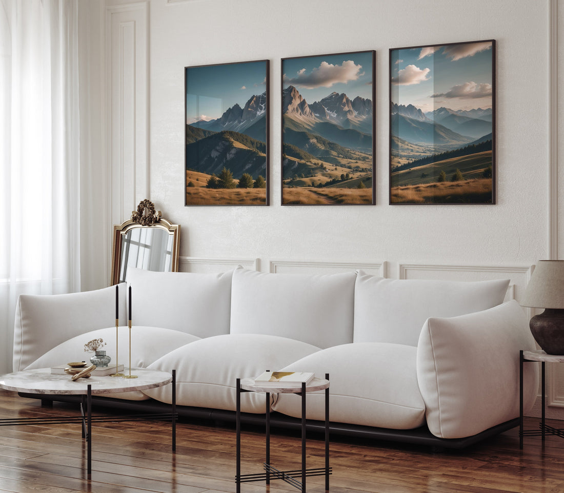 Modern living room with white sofa and a mountain landscape poster triptych on the wall