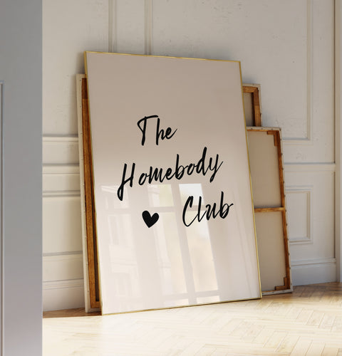 Framed artwork with 'The Homebody Club' text on a light background