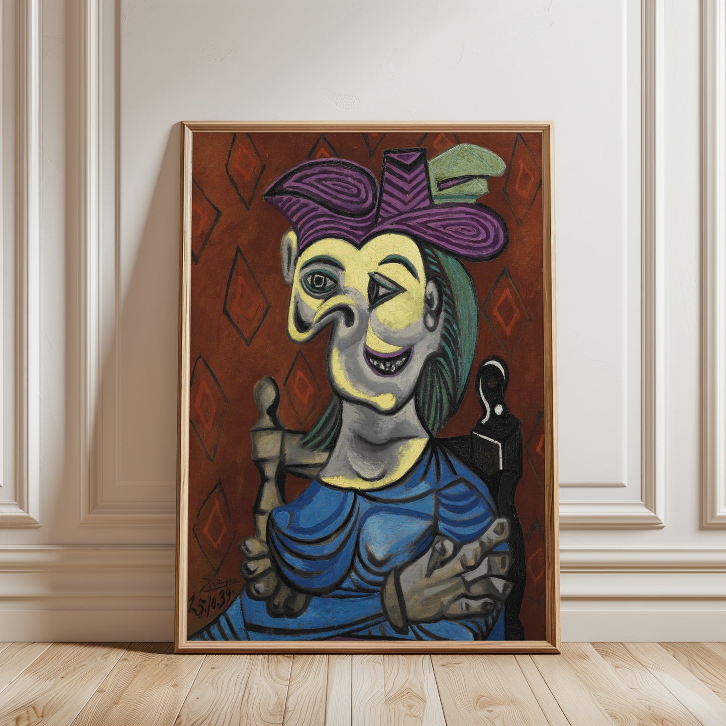 Framed artwork of a stylized figure with a purple hat on a wooden floor.