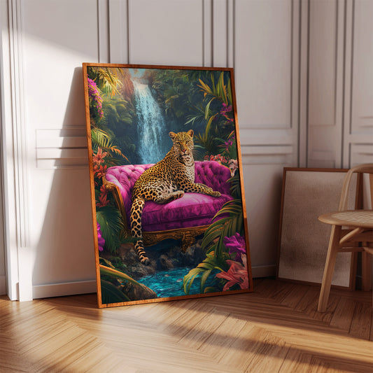 Framed artwork of a leopard on a pink couch with a jungle scene, leaning against a white wall.