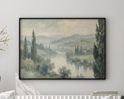 Living room with a white sofa, decorative pillows, and a framed landscape painting on the wall.