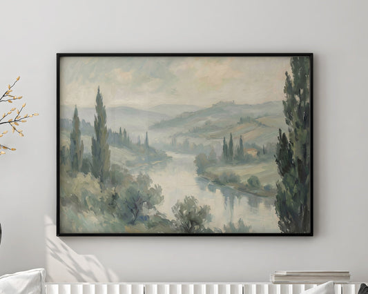 Living room with a white sofa, decorative pillows, and a framed landscape painting on the wall.