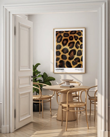 Dining room with a leopard print wall art piece